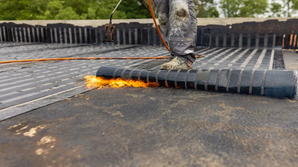 SBS membrane being installed with torch down (fire)