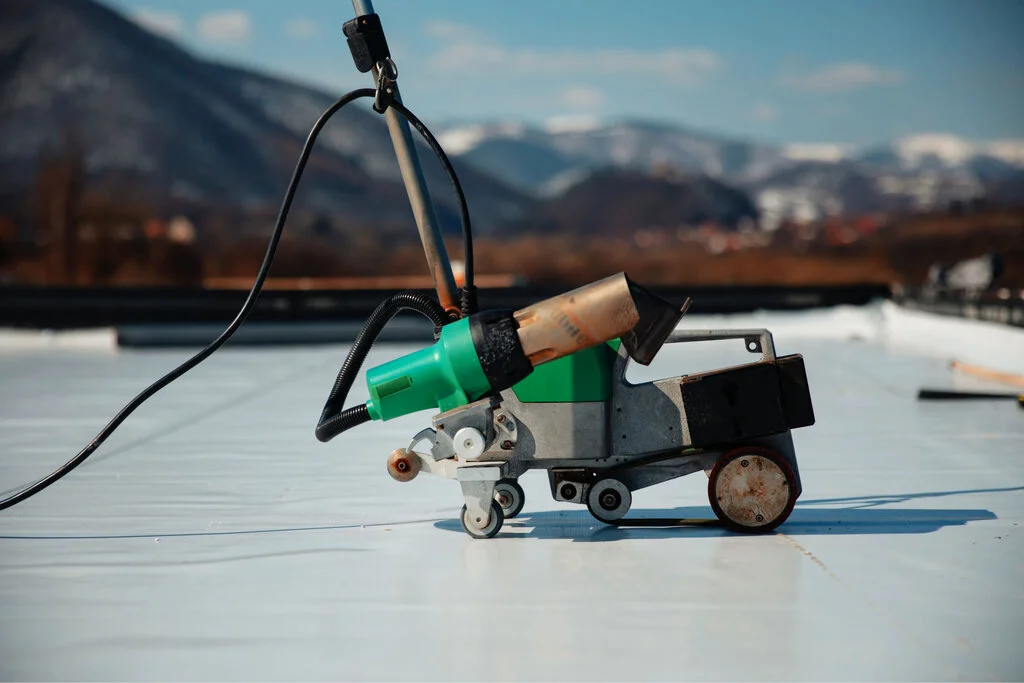 landscape photo of a welder being used on a EPDM surface